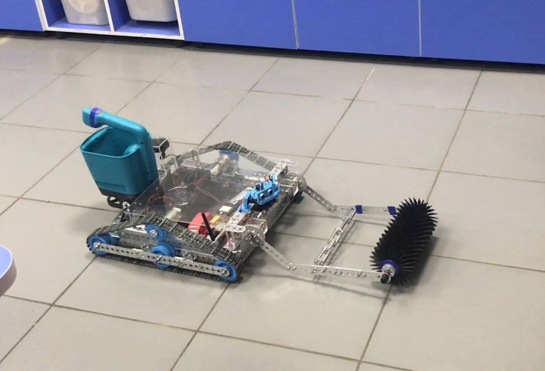 The Melt prototype: tracked chassis, front brush, reagent hopper